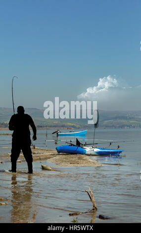 fisherman caught a large carp on the Sea of Galilee Stock Photo
