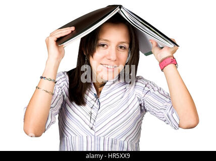 female student with book on head over white Stock Photo
