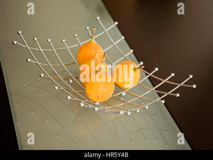 granadillas on a modern table - close up Stock Photo