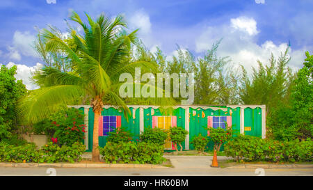 Container painted as a house by the roadside on Grand Cayman, Cayman Islands Stock Photo