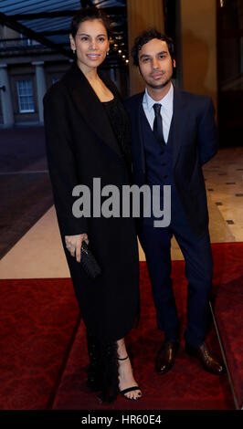 British Indian actor Kunal Nayyar, (right) and his wife Indian model Neha Kapur (left) arrive the Grand Entrance of Buckingham Palace for a reception to mark the launch of the UK-India Year of Culture 2017. Stock Photo