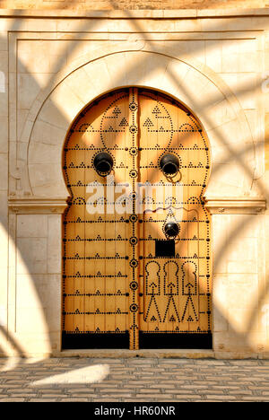 Traditional Tunisian door to a mosque Stock Photo