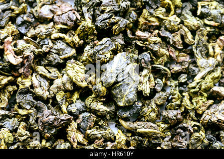 Closeup overhead image of loose tea leaves in a  compressed form. Stock Photo