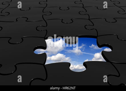 black puzzle with a piece missing that leads to the sky Stock Photo
