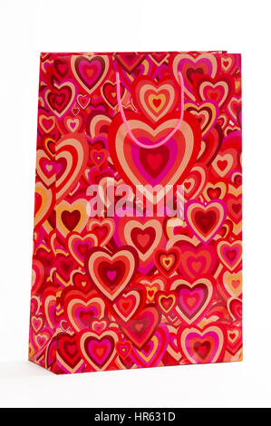 Red packet with hearts on a white background Stock Photo