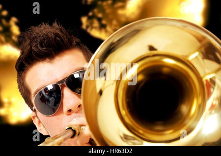 man playing the saxophone at a party Stock Photo