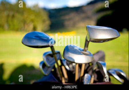 golf clubs close up in a golf course Stock Photo