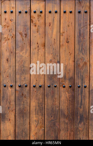 Wood door with rivets background Stock Photo