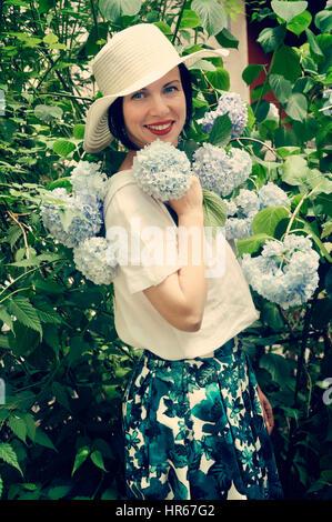 Portrait of a beautiful woman in the garden Stock Photo - Alamy