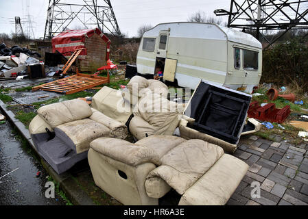 Travellers site, Tatton Road, Newport, South Wales. Smashed up caravans and fly-tipping, black bags and human waste left on the site. Stock Photo