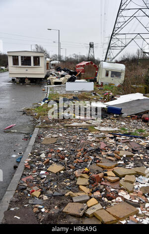 Travellers site, Tatton Road, Newport, South Wales. Smashed up caravans and fly-tipping, black bags and human waste left on the site. Stock Photo