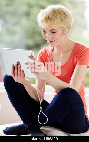 Girl relaxing using her iPad Stock Photo