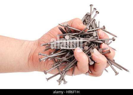 Man's hand holding metal nails. Closeup with clipping path isolated on white background Stock Photo