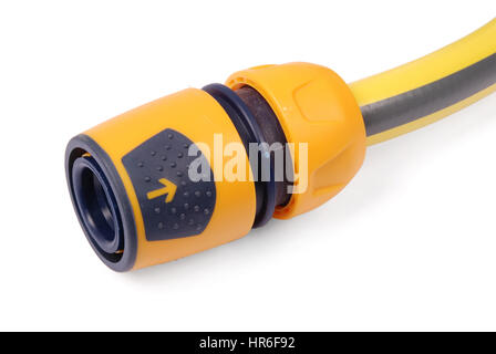 Yellow garden water hose and orange nozzle, isolated on white background with soft shadow Stock Photo