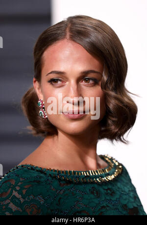 BEVERLY HILLS, LOS ANGELES, CA, USA - FEBRUARY 26: Actress Alicia Vikander  wearing a Louis Vuitton dress and Bulgari jewelry arrives at the 2017  Vanity Fair Oscar Party held at the Wallis
