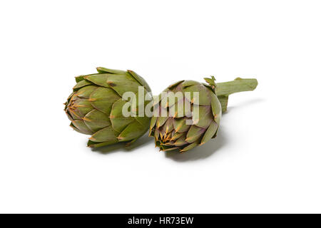 Two artichokes on a white background - closeup Stock Photo
