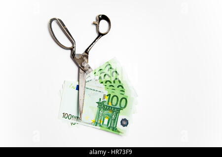 Scissors cuts euro banknote on white background Stock Photo