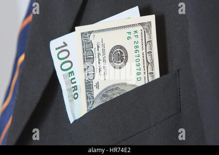 Dollars and Euros in the pocket of a suit Stock Photo