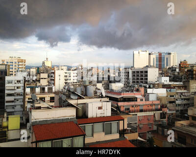 Dark skies hover over Beirut, Lebanon as seen from the rooftops in the Hamra neighborhood. Stock Photo