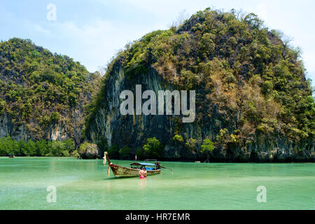 A man and a woman bathing in the karst-surrounded 'emerald lagoon', Koh Hong, Hong Islands, National Marine Park, Phang Nga Bay, Thailand. Stock Photo