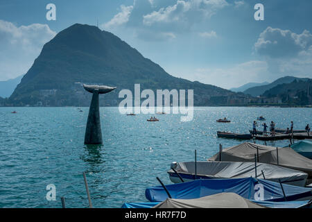 Save The Whale installation on Lake Lugano with Monte San Salvatore in the background Stock Photo