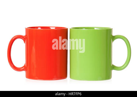 Two mugs - green and red - for coffee or tea, isolated on white background Stock Photo