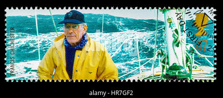 UNITED KINGDOM - CIRCA 2003: A used postage stamp printed in Britain celebrating British Explorers showing Yachtsman Francis Chichester and Gypsy Moth Stock Photo