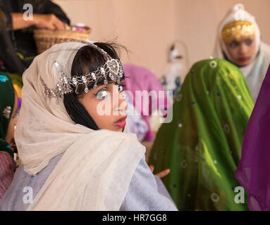 Muscat, Oman - Feb 4, 2017: Young Omani girl during a traditional wedding ritual display at Muscat cultural festival. Stock Photo