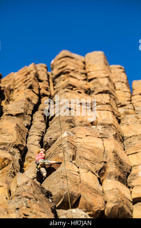 climbing rock pillar standing woman basalt alamy