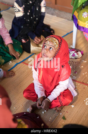 Muscat, Oman - Feb 4, 2017: Young Omani girl during a traditional wedding ritual display at Muscat cultural festival. Stock Photo