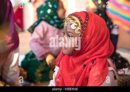 Muscat, Oman - Feb 4, 2017: Young Omani girl during a traditional wedding ritual display at Muscat cultural festival. Stock Photo