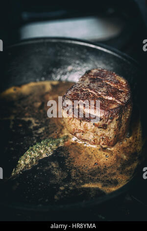 Close up of beef steak fried in pan Stock Photo