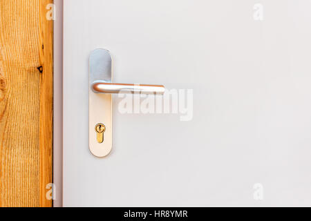 Modern metallic door handle with copy space Stock Photo