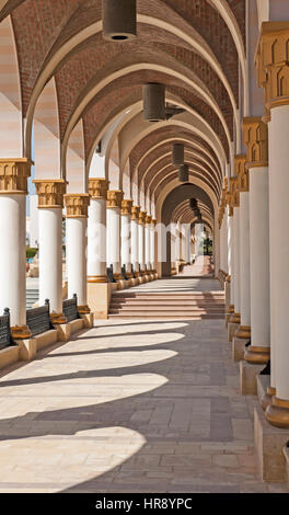 Corridor of arches diminishing to vanishing point at infinity abstract architecture Stock Photo