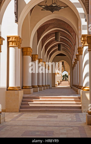 Corridor of arches diminishing to vanishing point at infinity abstract architecture Stock Photo