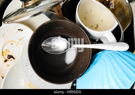 Dirty dishes in a sink Stock Photo