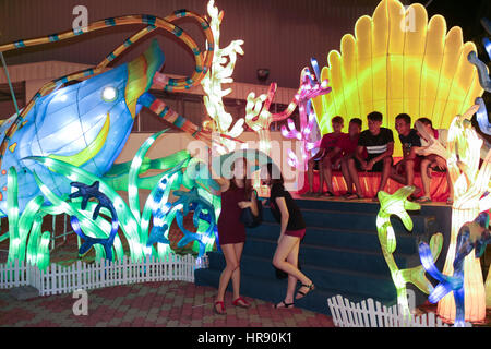 Friends taking photo with LED light replica of marine lifes at Fo Guang Shan temple, Jenjarom, Malaysia. Stock Photo