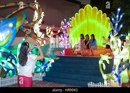 Friends taking photo with LED light replica of marine lifes at Fo Guang Shan temple, Jenjarom, Malaysia. Stock Photo