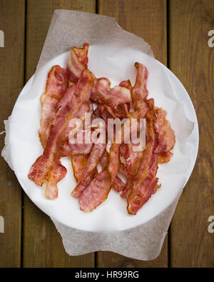 A plate of fried, crispy bacon Stock Photo