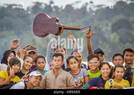 Group of happy teenagers have fun on a beach in Fakfak, West Papua province, Indonesia. Stock Photo