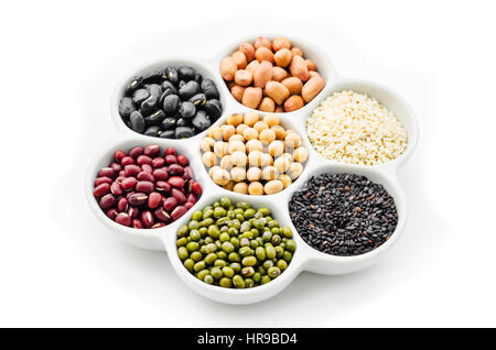A variety of nuts in a cup isolated on white background. Stock Photo