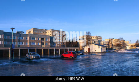 UMEA, SWEDEN ON DECEMBER 20, 2016. View of a modern residential, car park, housing. Icy ground, sunset, winter. Editorial use. Stock Photo