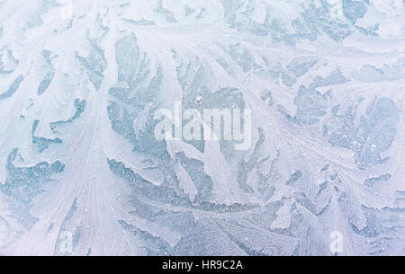 Beautiful abstract and leafy patterns on car front window created by ice crystals growing from a thin layer of wateror dew, winter in Oslo Norway Stock Photo