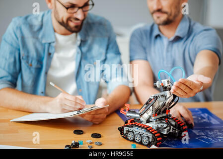 Professional engineers testing the robot Stock Photo