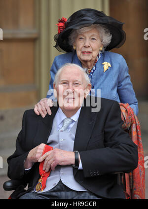 Sir Roger Bannister, 87, who was the first man to break the four-minute mile, at Buckingham Palace in central London with his wife Moyra, after receiving his award as a Companion of Honour from the Duke of Cambridge. Stock Photo