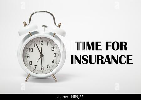 White old clock with text  TIME FOR INSURANCE Stock Photo