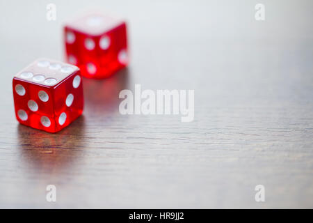 Two Red Dices Isolated on Desktop with Right Space Stock Photo