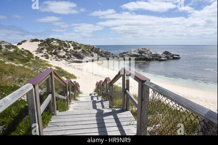 Boardwalk beach entrance with Indian Ocean view, dunes and limestone outcropping at Rottnest Island in Western Australia. Stock Photo