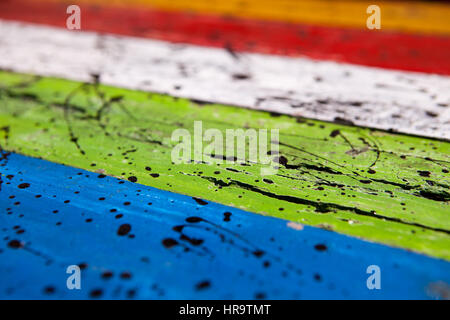 Patterned and textures background of brightly colored panels of weathered painted wooden boards Stock Photo