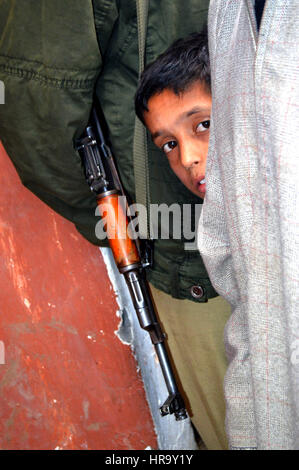 Kashmiri boy fear....  (Photo Copyright © by Saji Maramon) Stock Photo